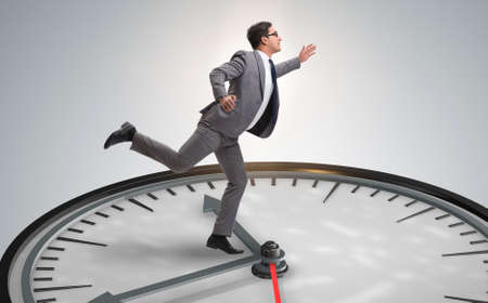 Businessman in time management conceptの写真素材