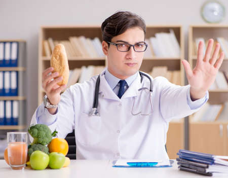 Scientist studying nutrition in various foodの写真素材