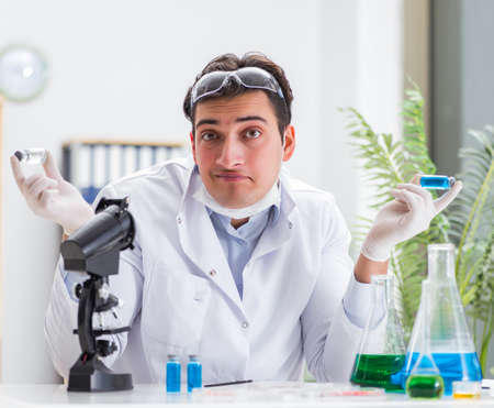 Male doctor working in the lab on virus vaccineの写真素材