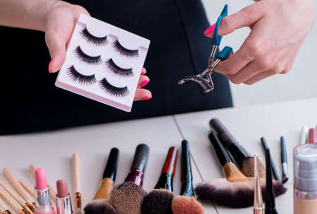 Collection of make up products displayed on the tableの写真素材