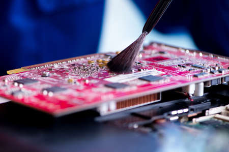 Repairman working in technical support fixing computer laptop troubleshooting