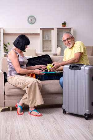 Old couple preparing for vacation travelの写真素材