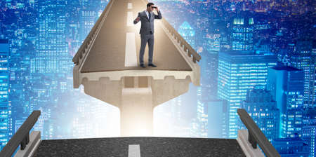 Businessman ready to overcome the broken bridgeの写真素材