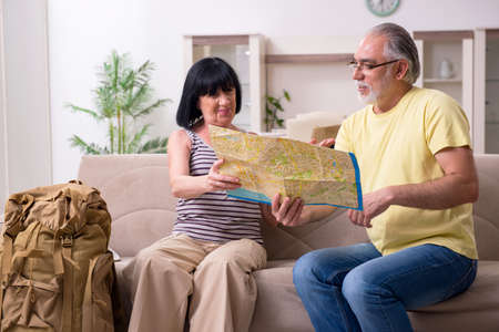 Old couple preparing for vacation travelの写真素材