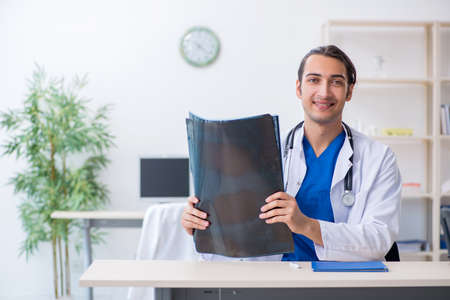 Young male doctor working in the clinic