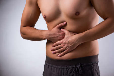 Young man suffering from stomachache