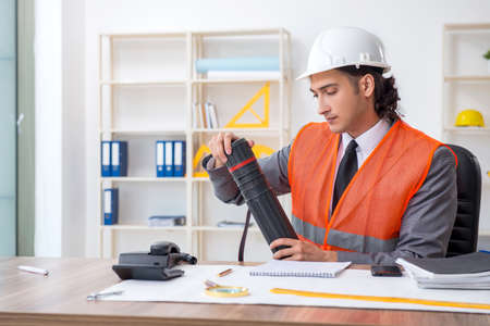 Young male architect working in the officeの写真素材