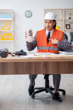 Young male architect working in the officeの写真素材