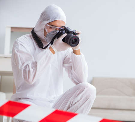 Forensic expert at crime scene doing investigation