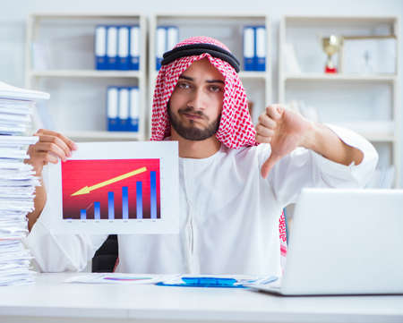 Arab businessman working in the office doing paperwork withの写真素材