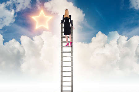 Businesswoman reaching out for stars in success concept