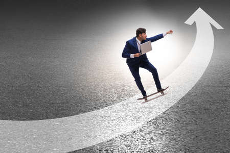 Businessman riding skateboard on financial graph