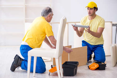 Two contractors carpenters working indoors