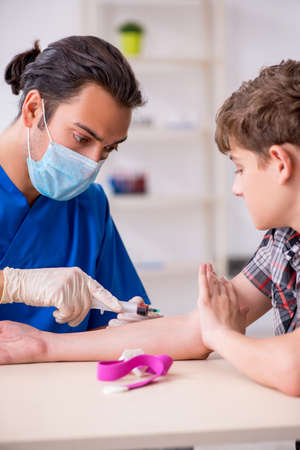 Young boy visiting doctor in hospitalの写真素材
