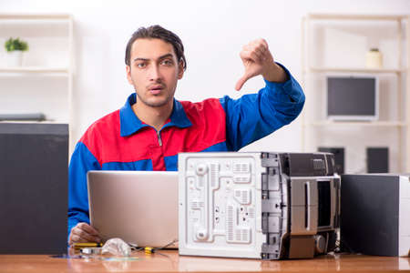 Young engineer repairing musical hi-fi systemの写真素材