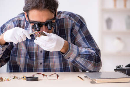 Young male jeweler at workshop