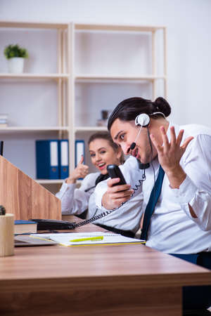 Call center operators working in the officeの写真素材