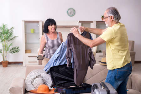 Old couple preparing for vacation travelの写真素材