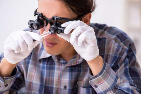 Young male jeweler at workshop