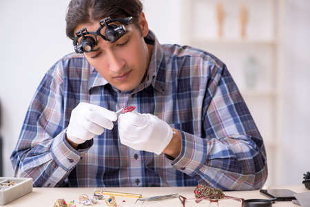 Young male jeweler at workshop
