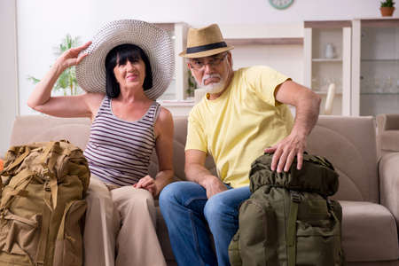 Old couple preparing for vacation travelの写真素材