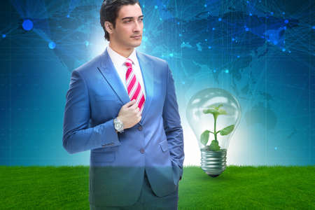 Green energy anc ecology concept with businessmanの写真素材