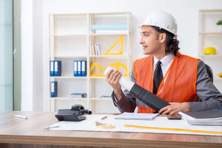 Young male architect working in the officeの写真素材