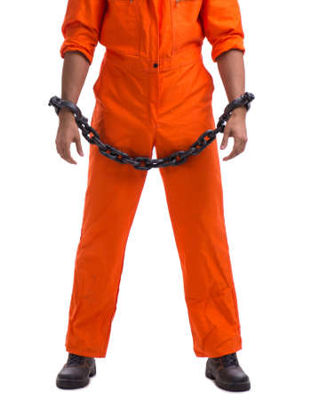The prisoner with his hands chained isolated on white background