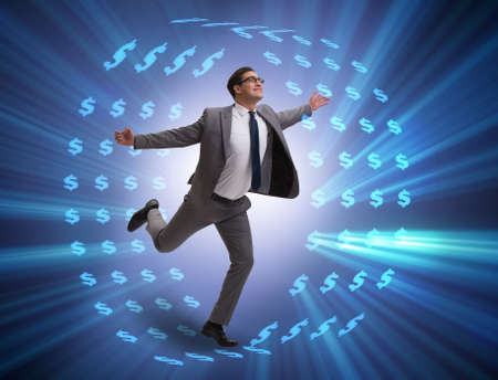 Businessman in hamster wheel chasing dollarsの写真素材