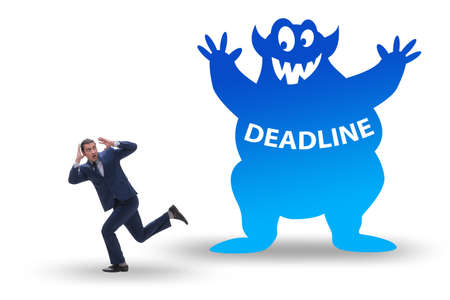 Businessman missing important deadline with monsterの写真素材