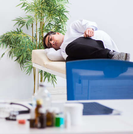 Doctor relaxing after complex surgery in hospital