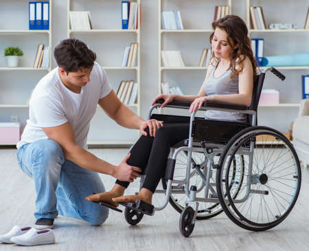 Patient undergoing rehabilitation recovery programme with doctor
