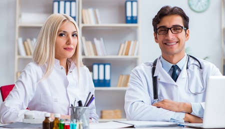 The male and female doctor having discussion in hospital