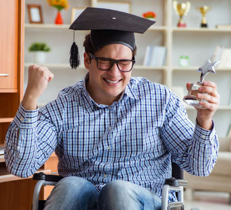 The disabled student studying at home on wheelchairの写真素材