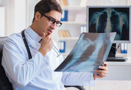 The doctor radiologist looking at x-ray images