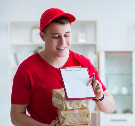 Post man delivering a parcel packageの写真素材