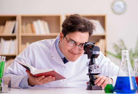 Mad crazy scientist doctor doing experiments in a laboratory