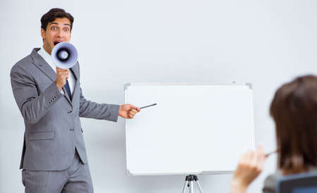 Business presentation in the office with man and womanの写真素材