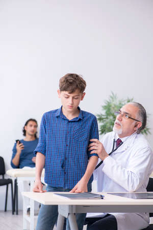 Young boy visiting doctor in hospitalの写真素材
