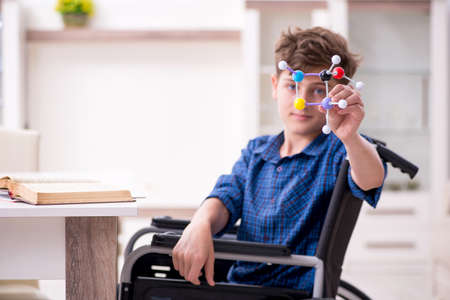 Disabled kid preparing for school at homeの写真素材