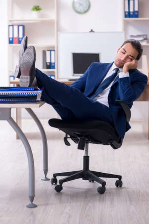 Young male businessman working in the officeの写真素材