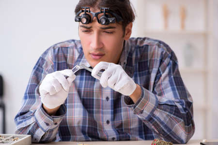 Young male jeweler at workshop