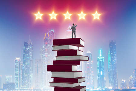 Business education concept with businessman and booksの写真素材