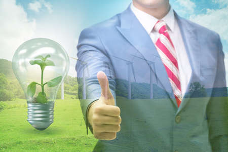 Green energy anc ecology concept with businessmanの写真素材