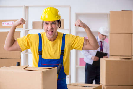 Professional movers doing home relocationの写真素材