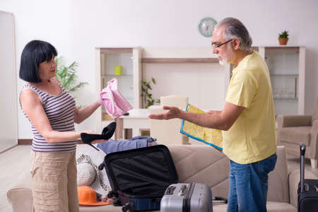 Old couple preparing for vacation travelの写真素材