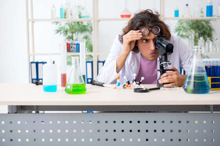 Funny male chemist working in the labの写真素材
