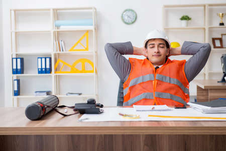 Young male architect working in the officeの写真素材