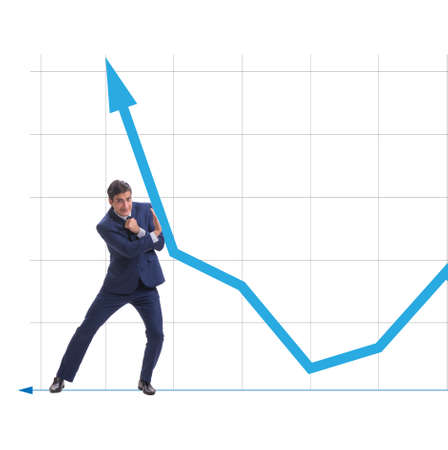 Businessman trying to help economic growth in business conceptの写真素材