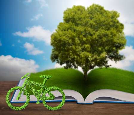 Open book and bicycle in ecological concept - 3d renderingの写真素材
